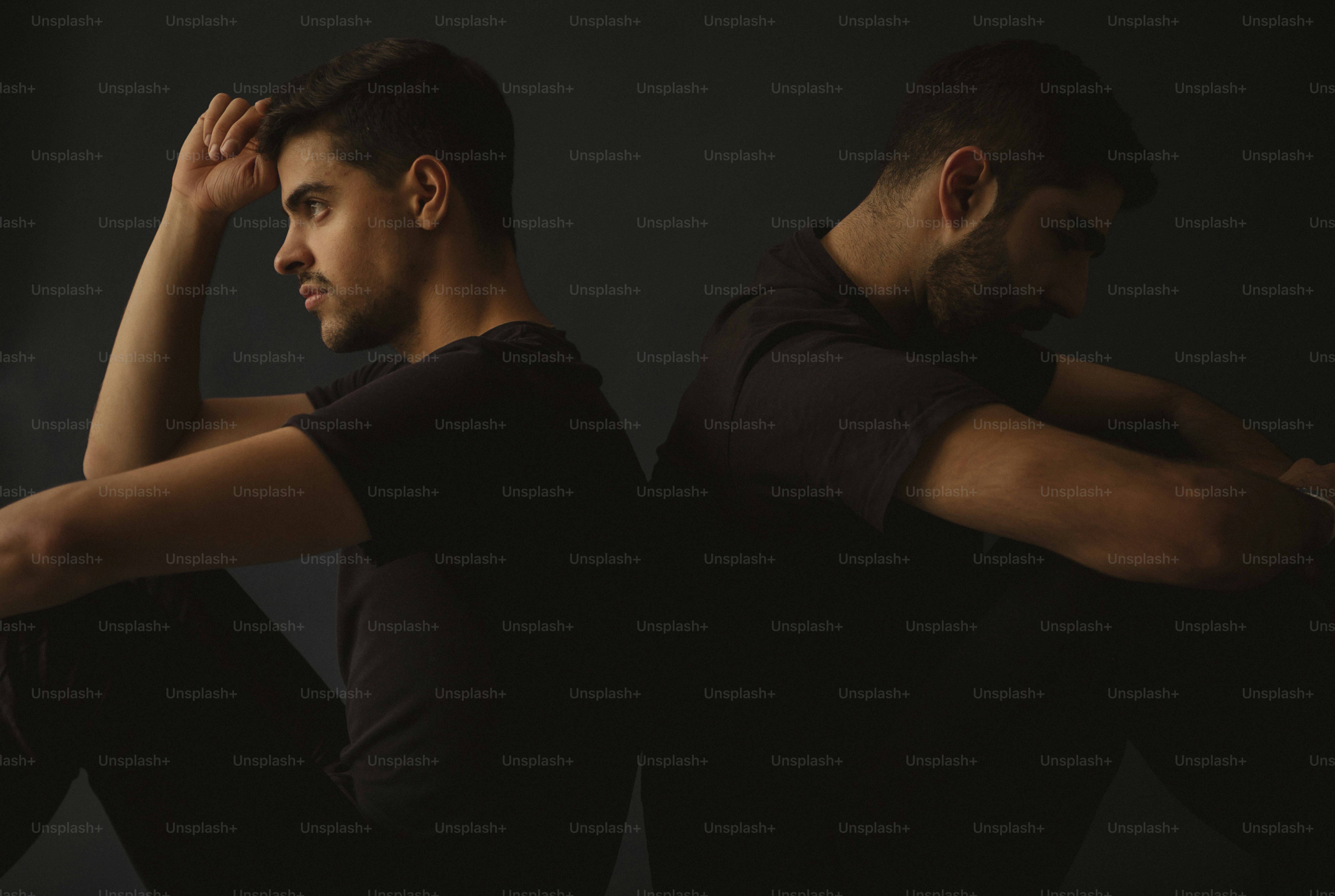 a couple of men sitting next to each other