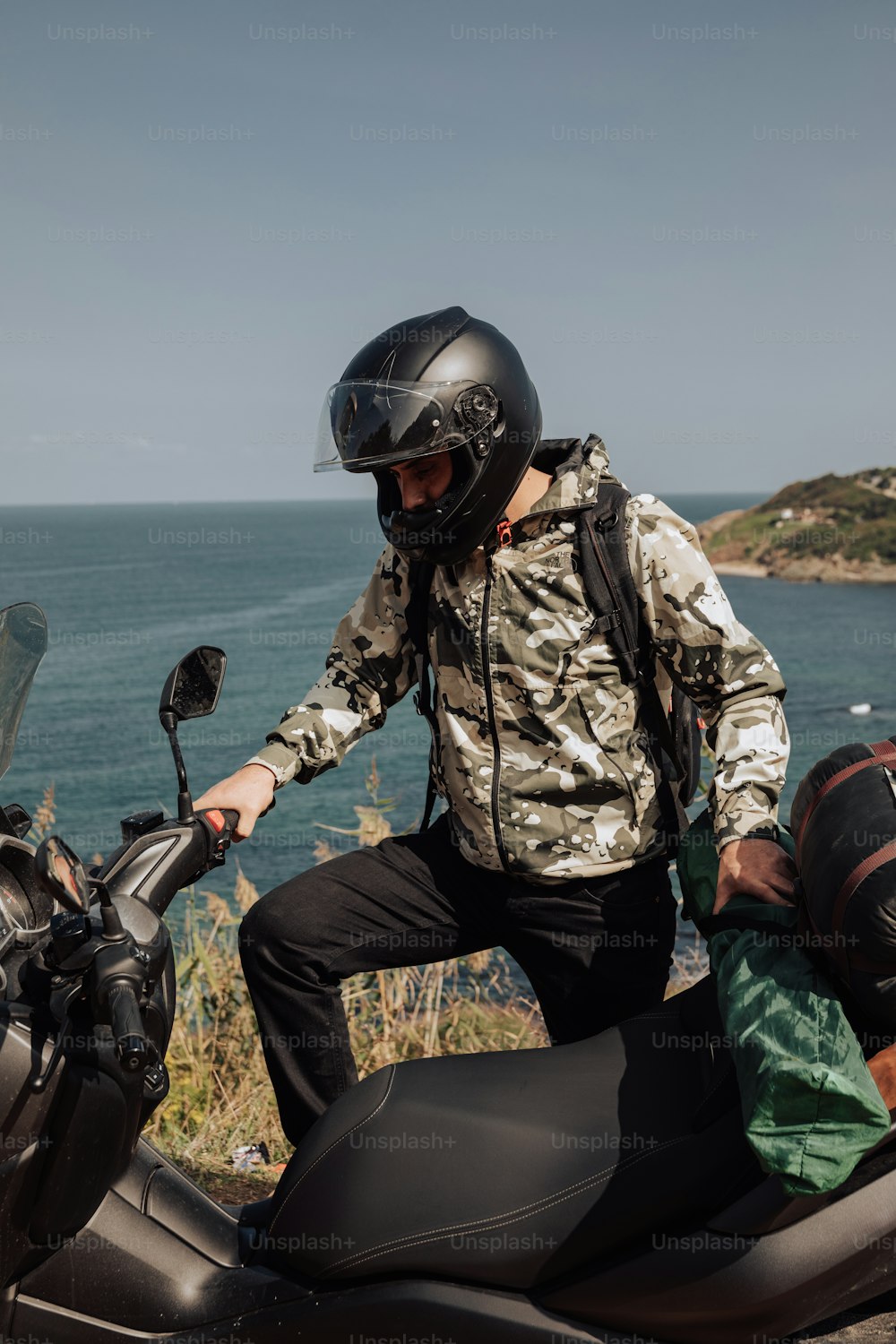 a man on a motorcycle with a helmet on