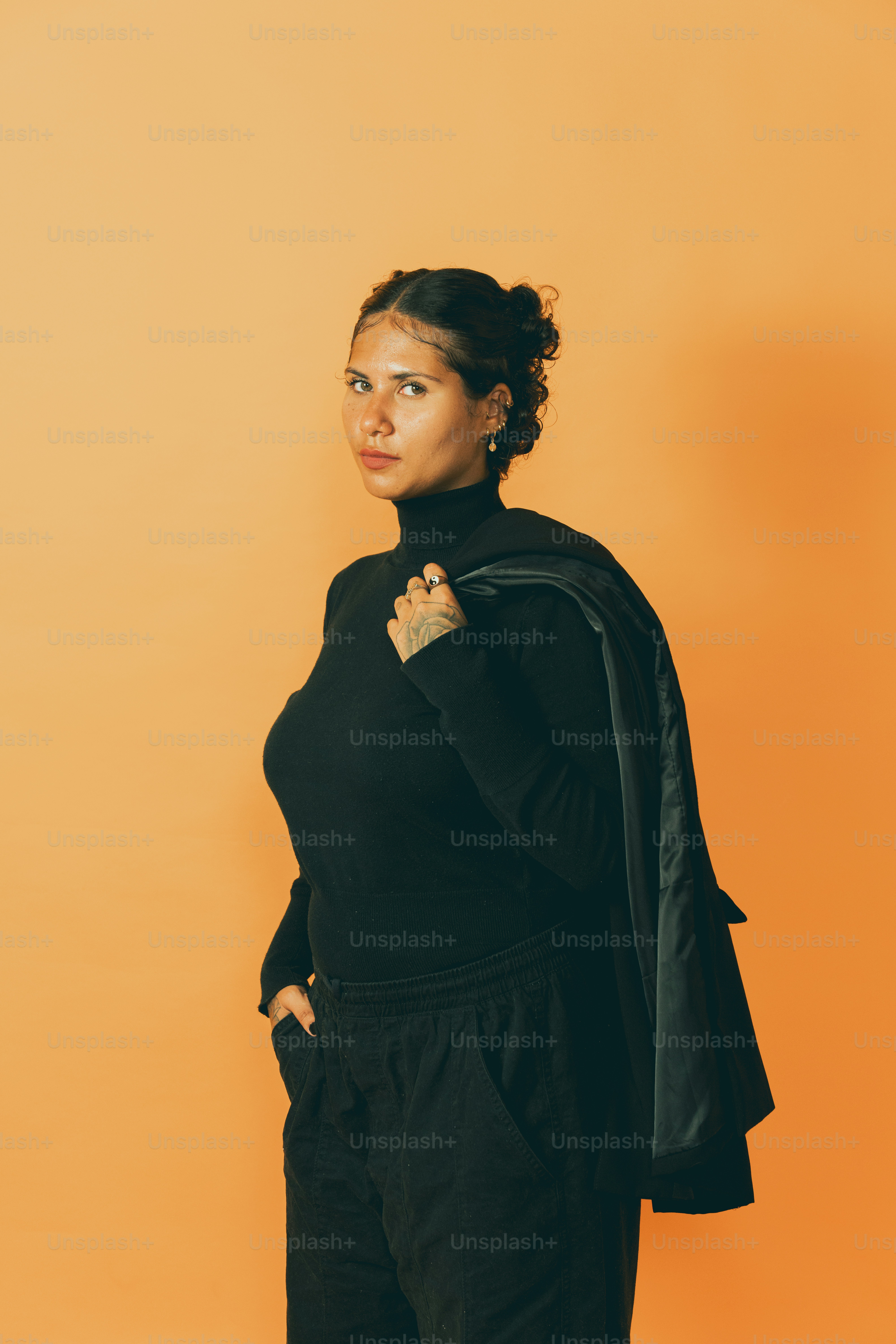 a woman in a black top and black pants