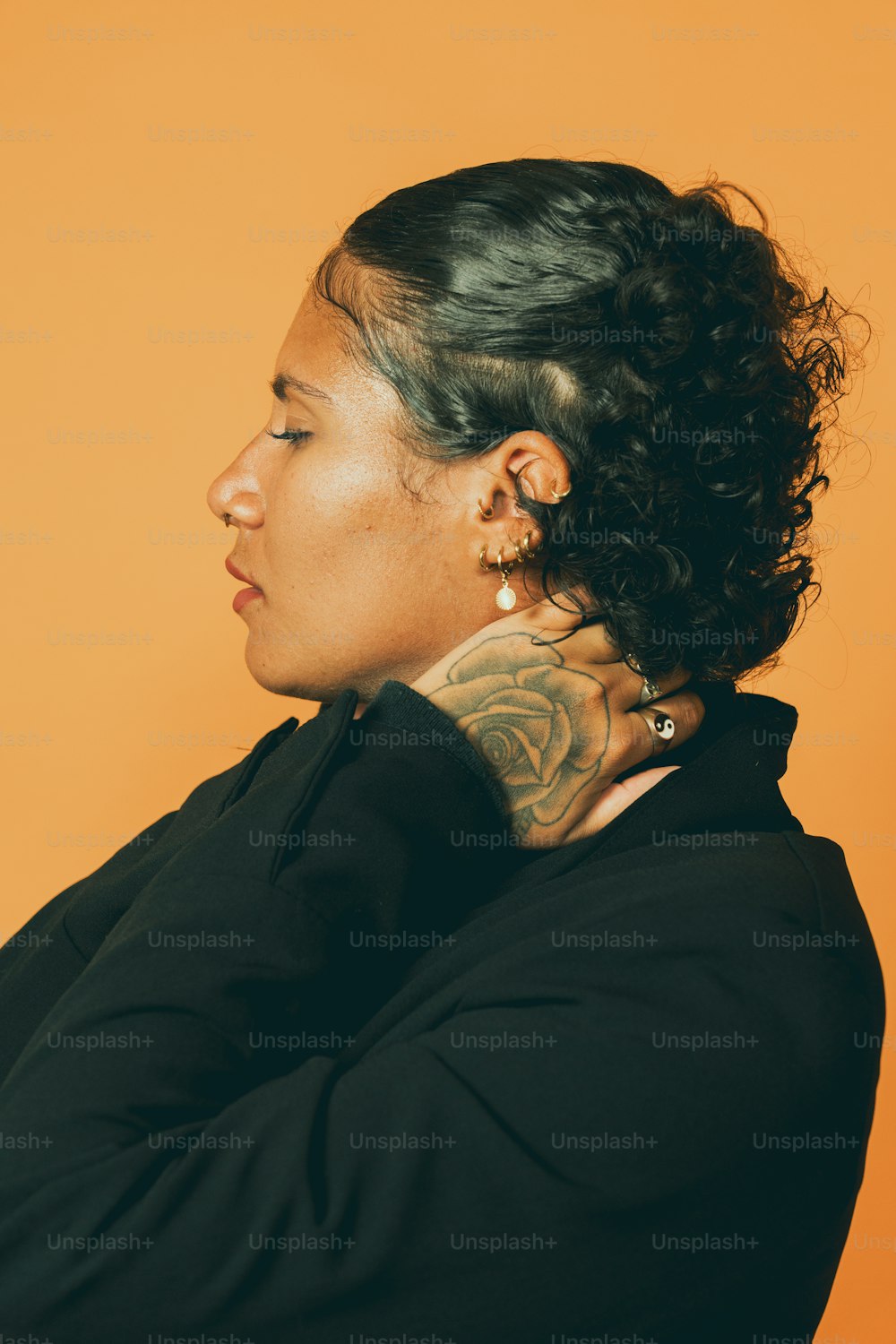 a woman with a tattoo on her neck