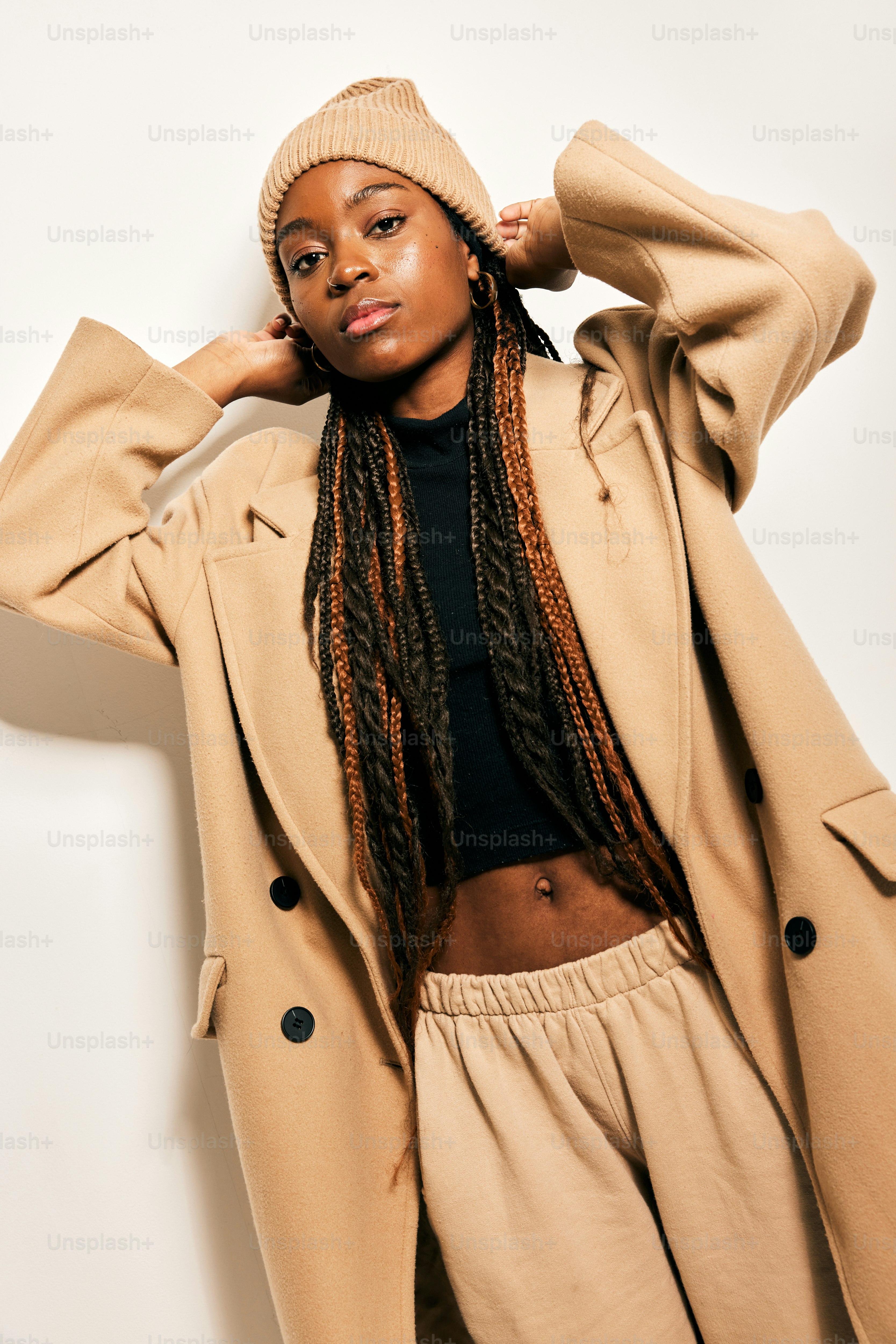 a woman with dreadlocks is posing for a picture