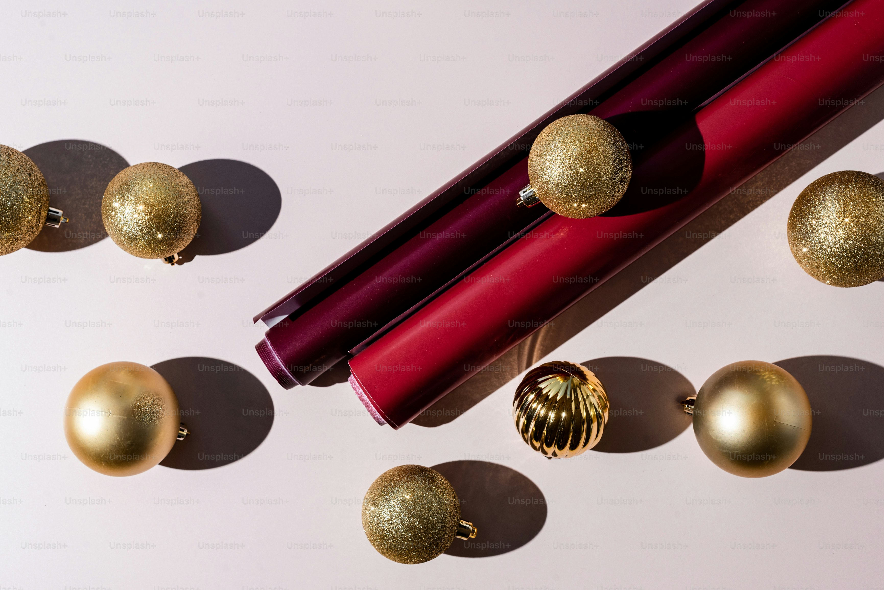 A close up of a lipstick and some christmas ornaments photo Gift