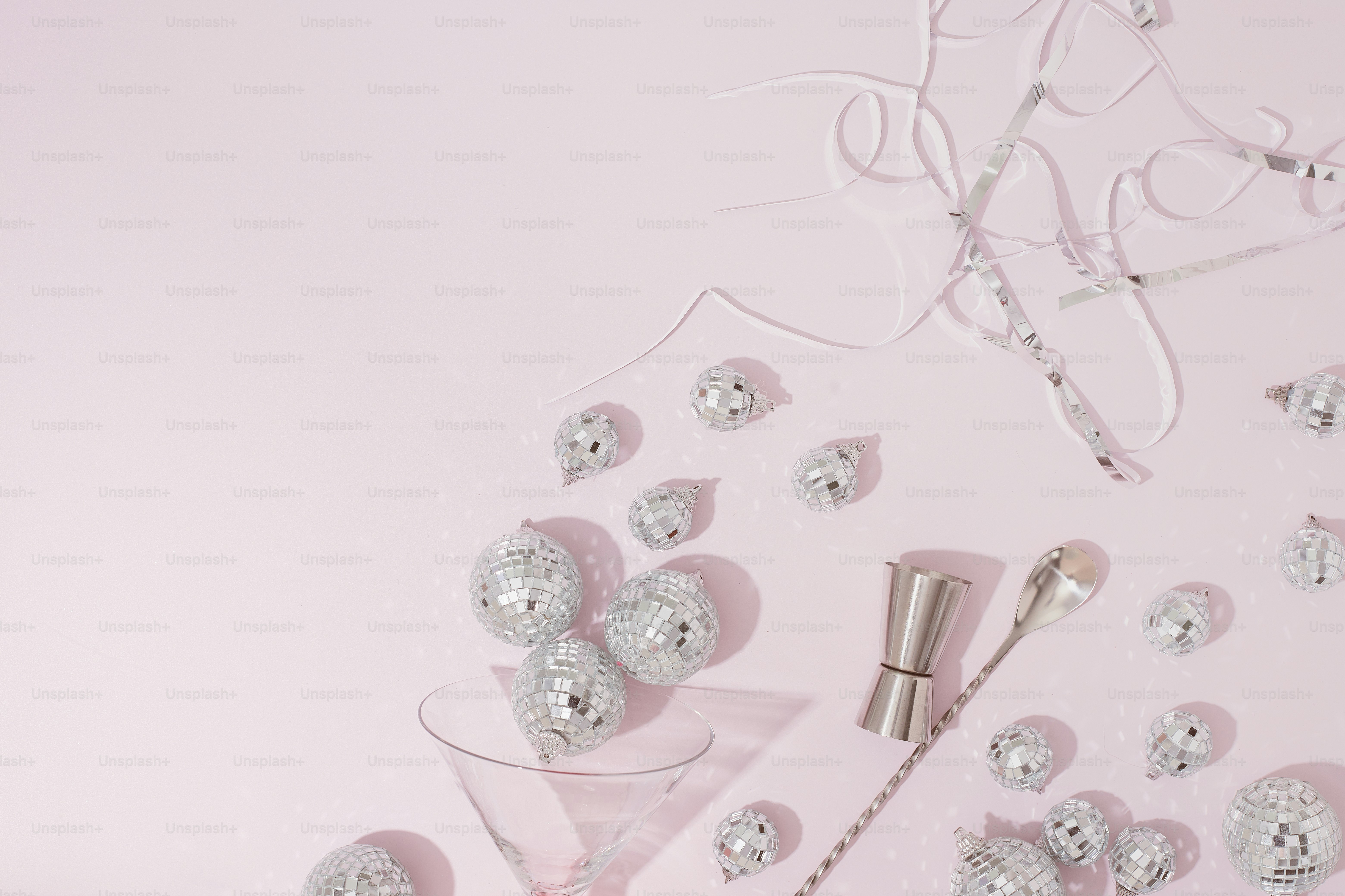 a table topped with a glass filled with candy