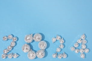 a number of balls and numbers on a blue surface