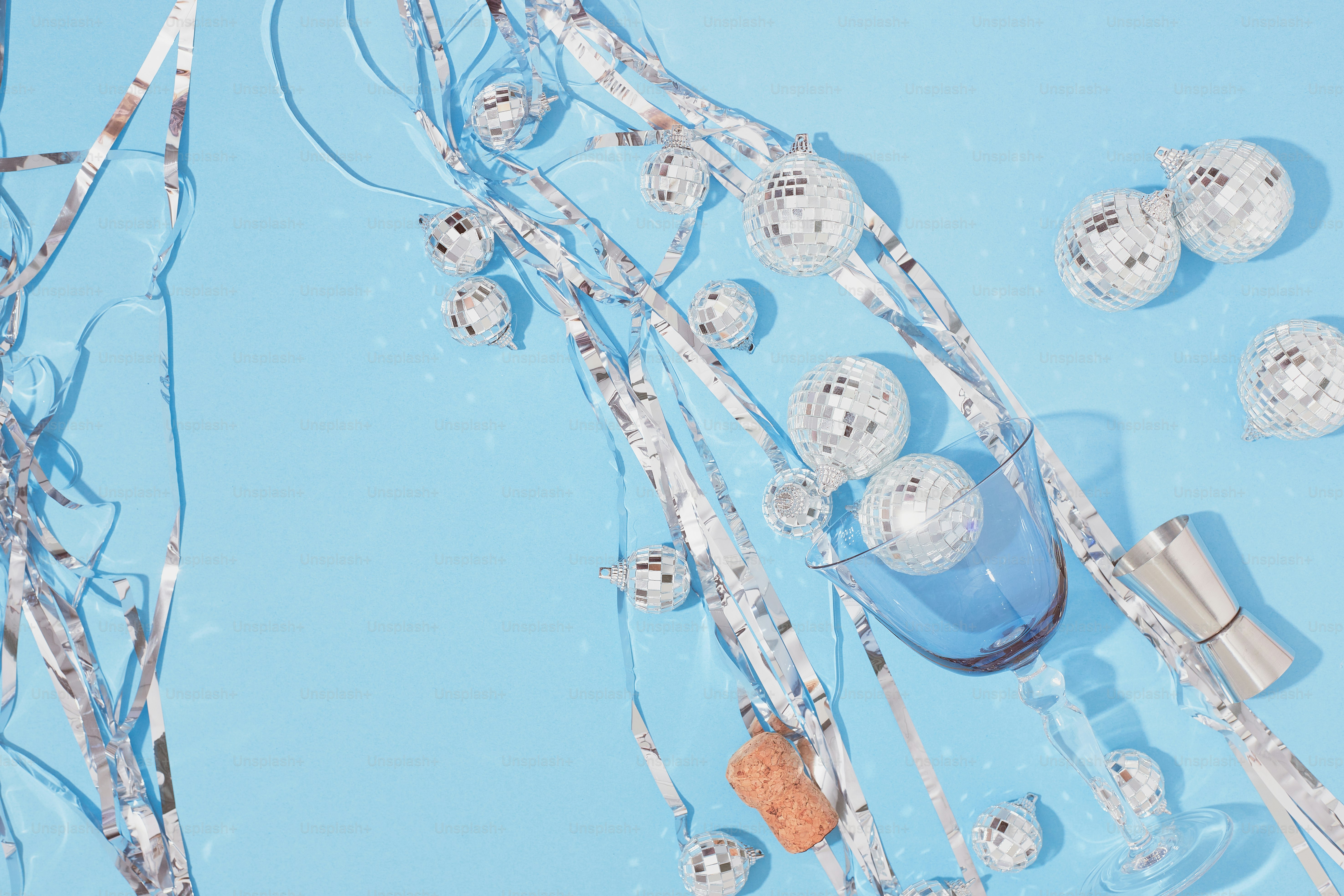 a blue table topped with lots of glass balls