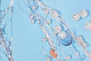 a blue table topped with lots of glass balls