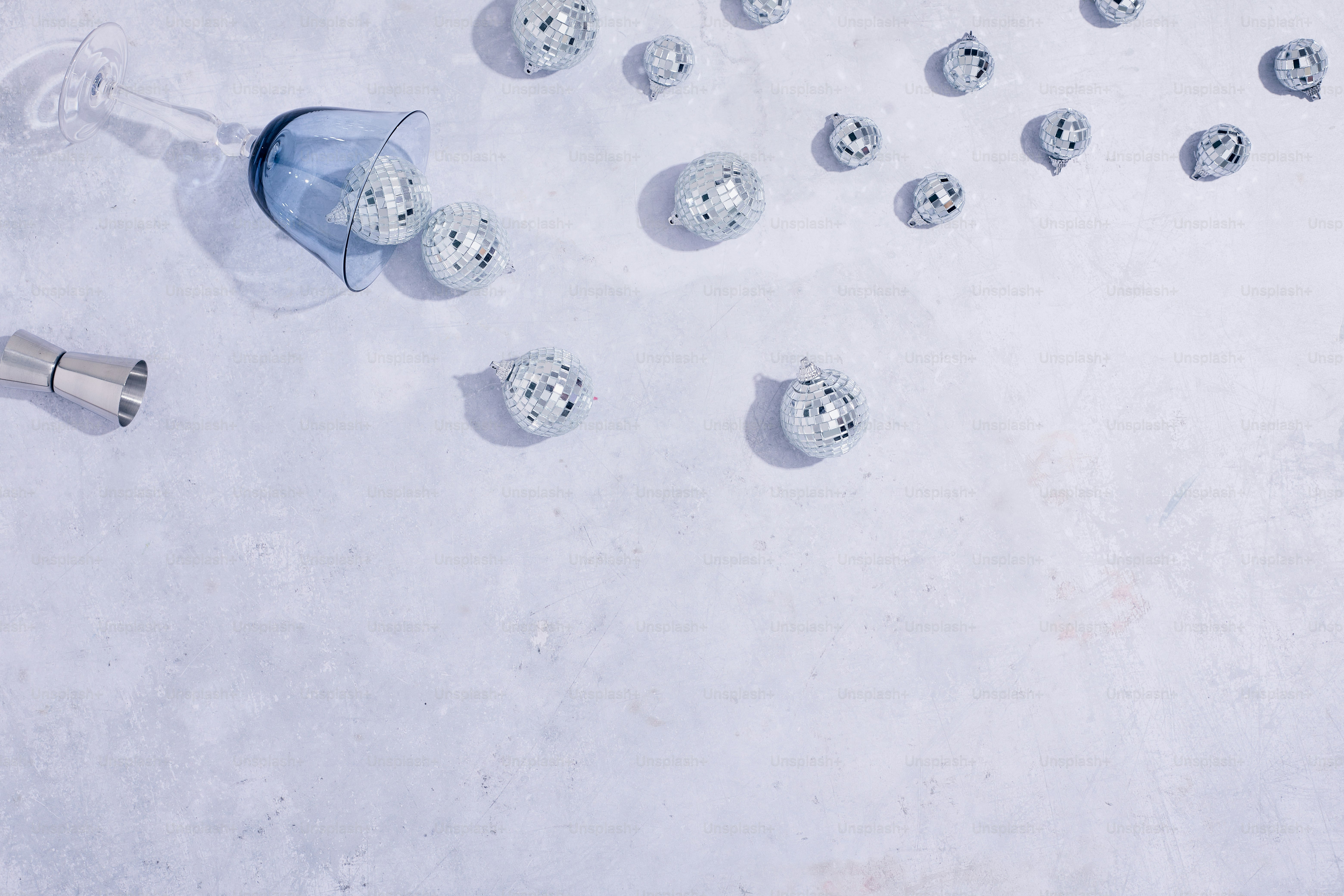 a bunch of doughnuts and a wine glass on a table