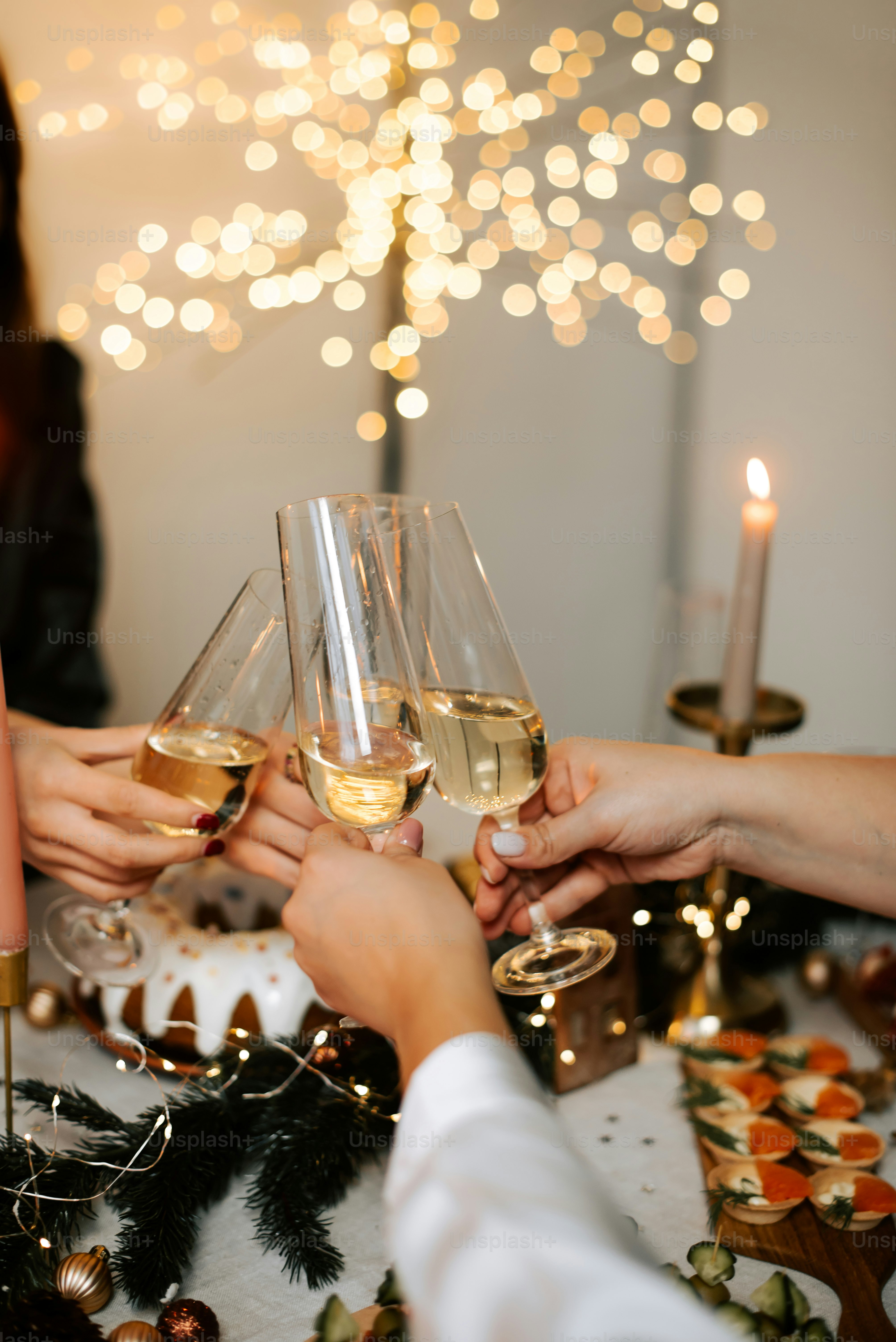 a group of people toasting with wine glasses