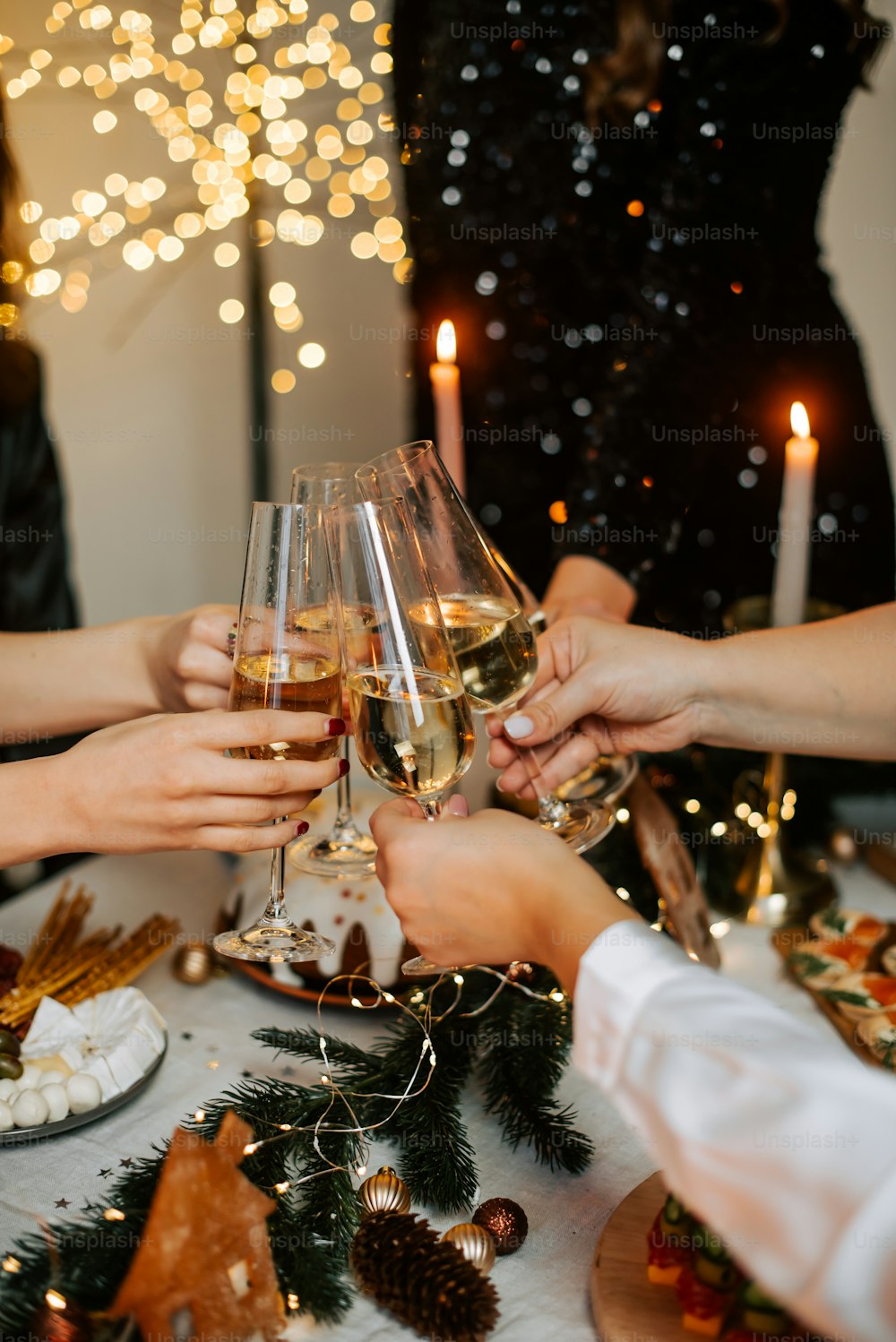 a group of people toasting with wine glasses