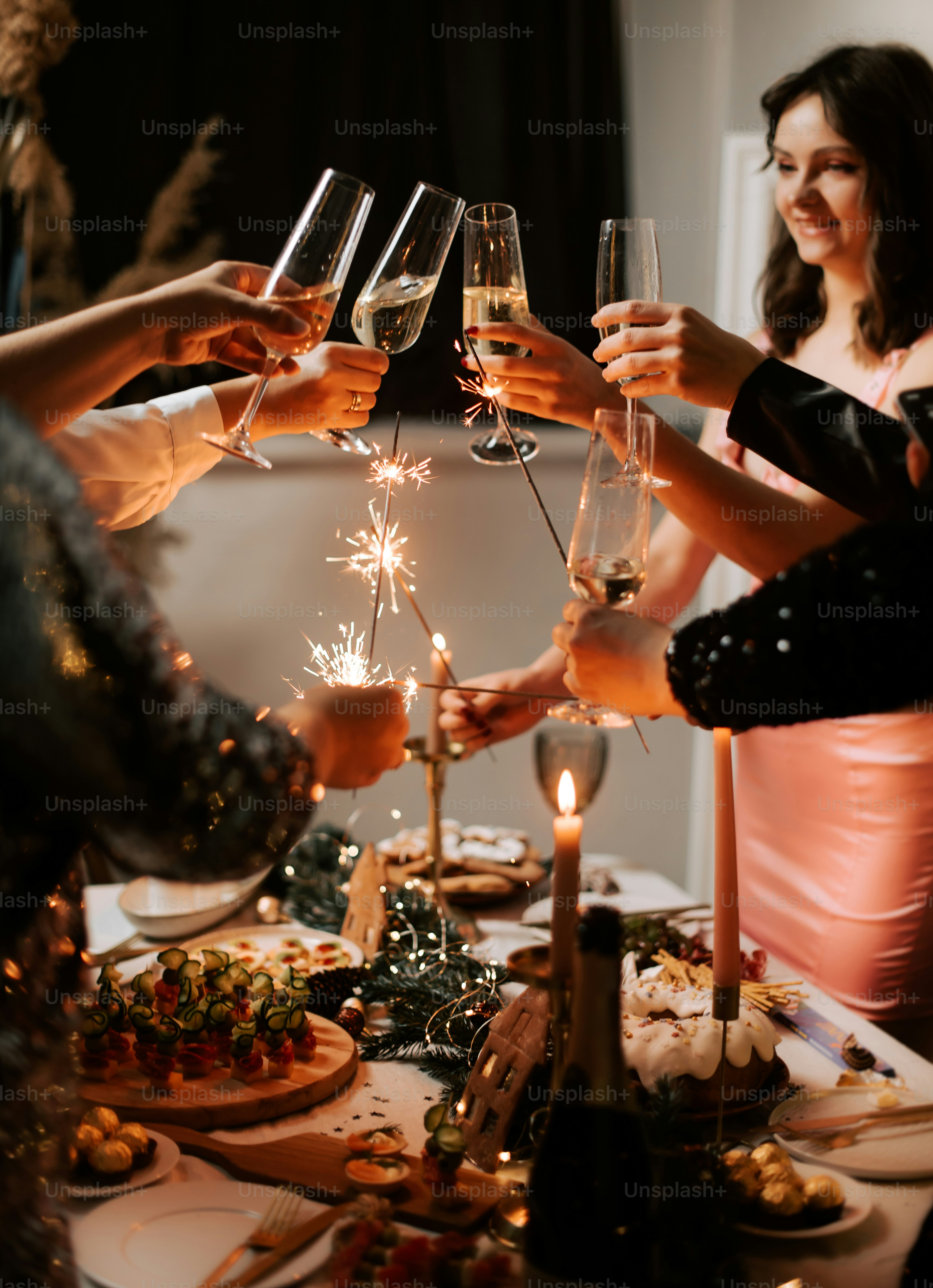 a group of people toasting with wine glasses