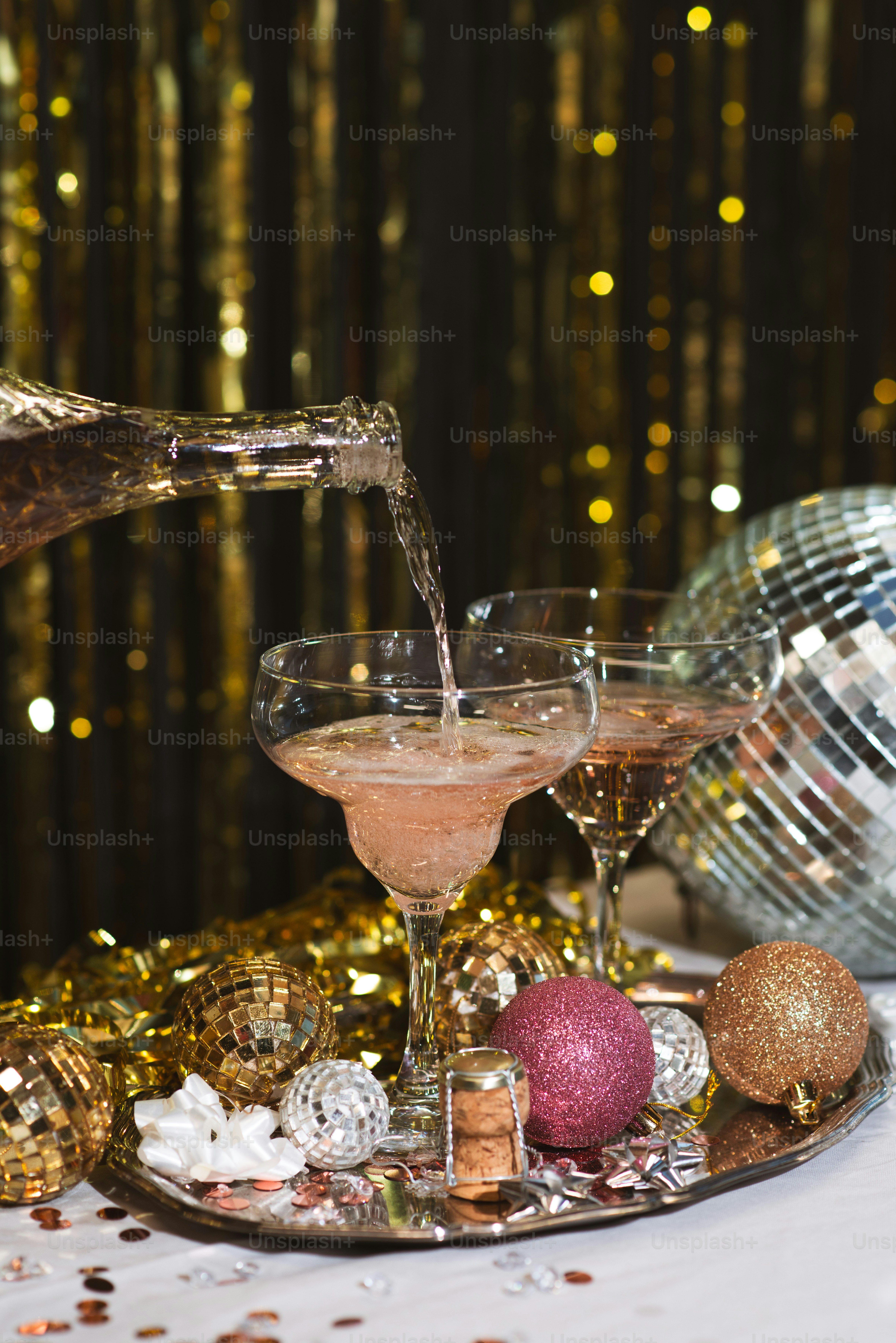 a glass of champagne being poured into a glass