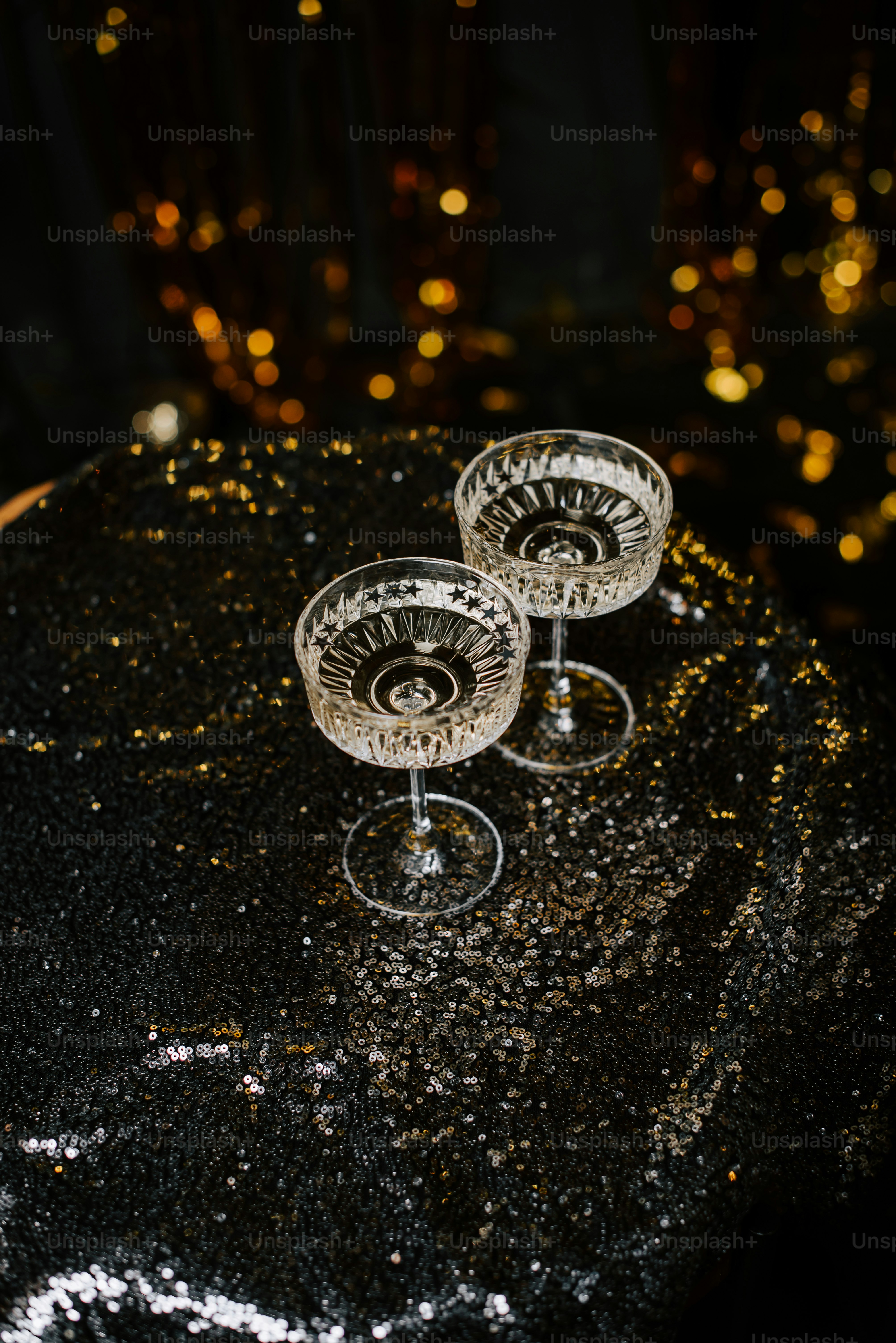 a couple of wine glasses sitting on top of a table