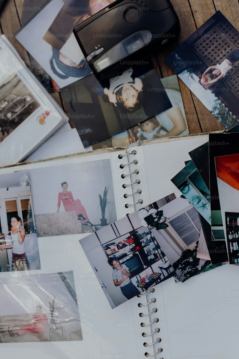 a bunch of photographs are spread out on a table
