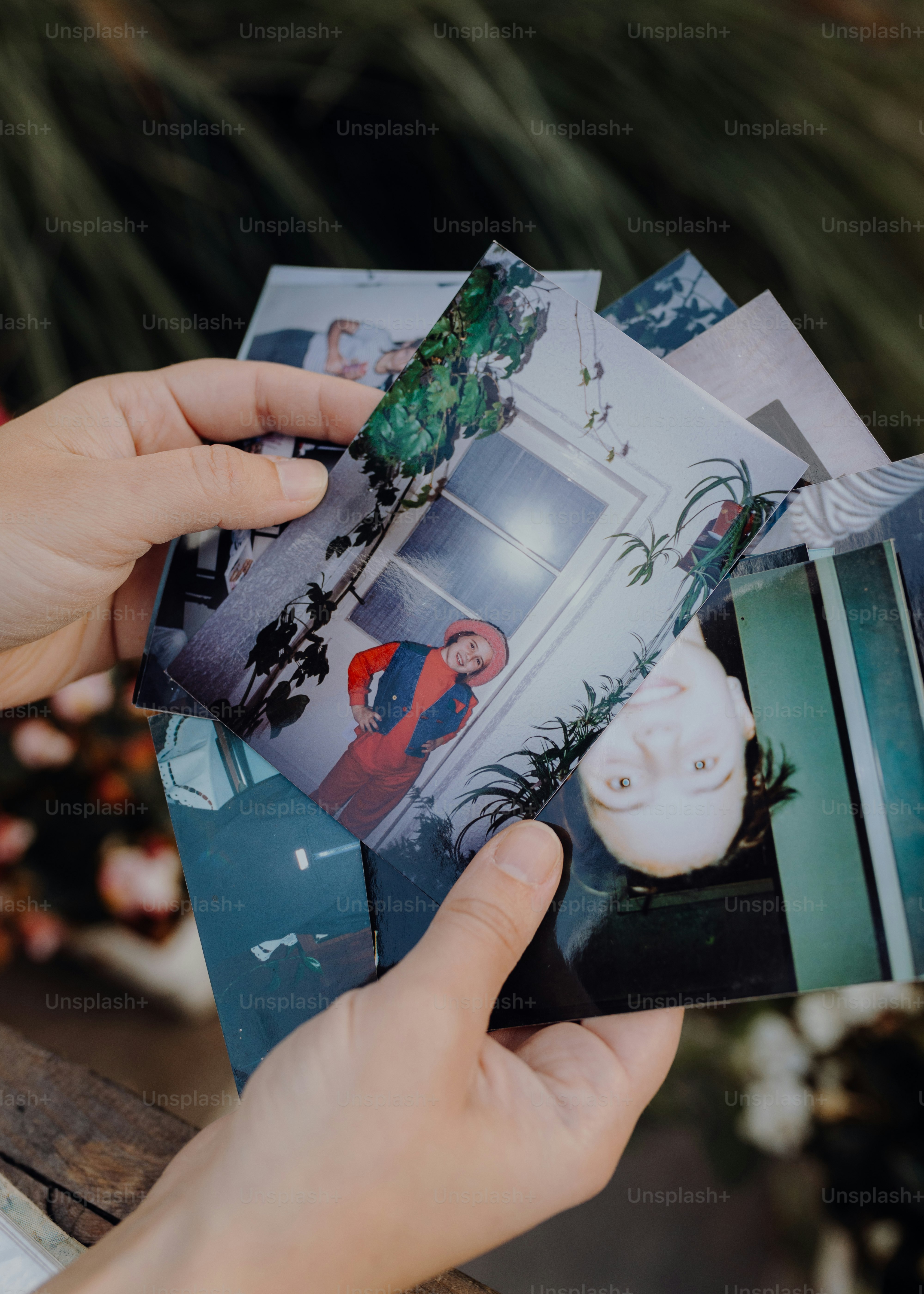 a person holding a photo of a house