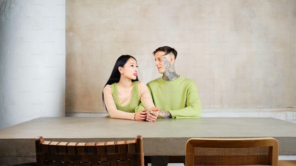 a man and a woman sitting at a table