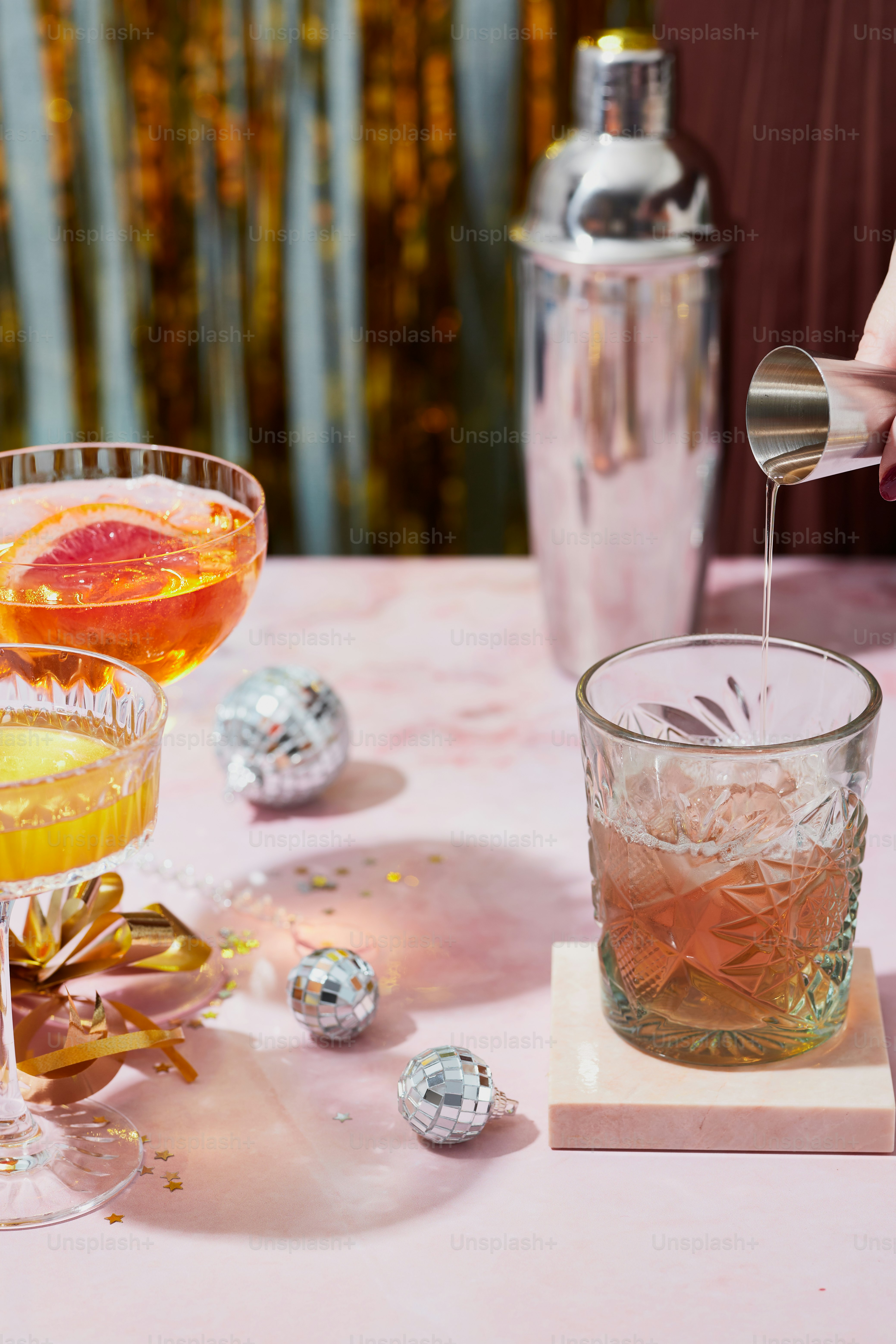 a table topped with two glasses filled with drinks