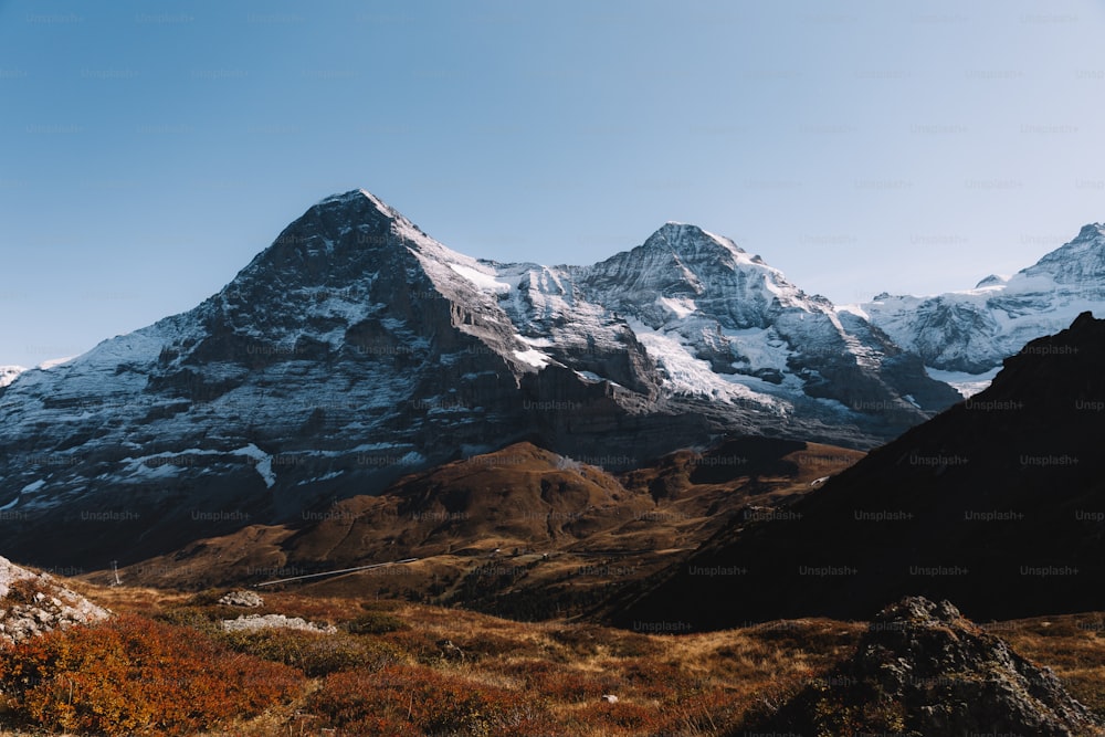 a mountain range with snow on top of it