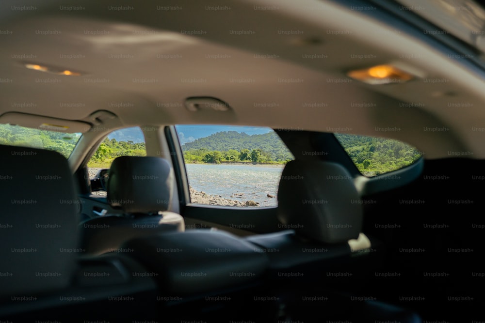 a view of a river from inside a car