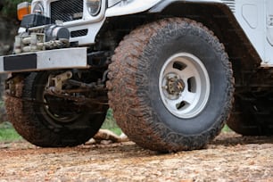 a close up of the front wheels of a jeep