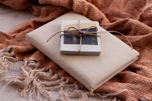 a wrapped present sitting on top of a blanket