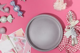 a cake pan sitting on top of a pink table