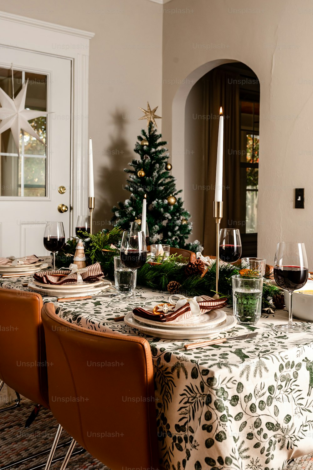 a dining room table with a christmas tree on it