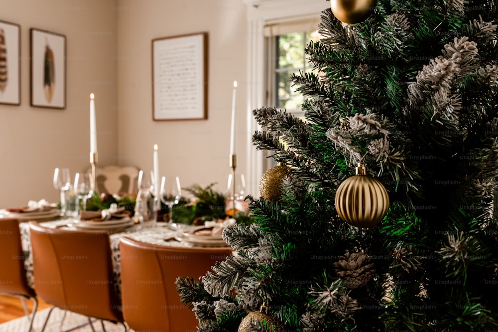 a decorated christmas tree in a dining room