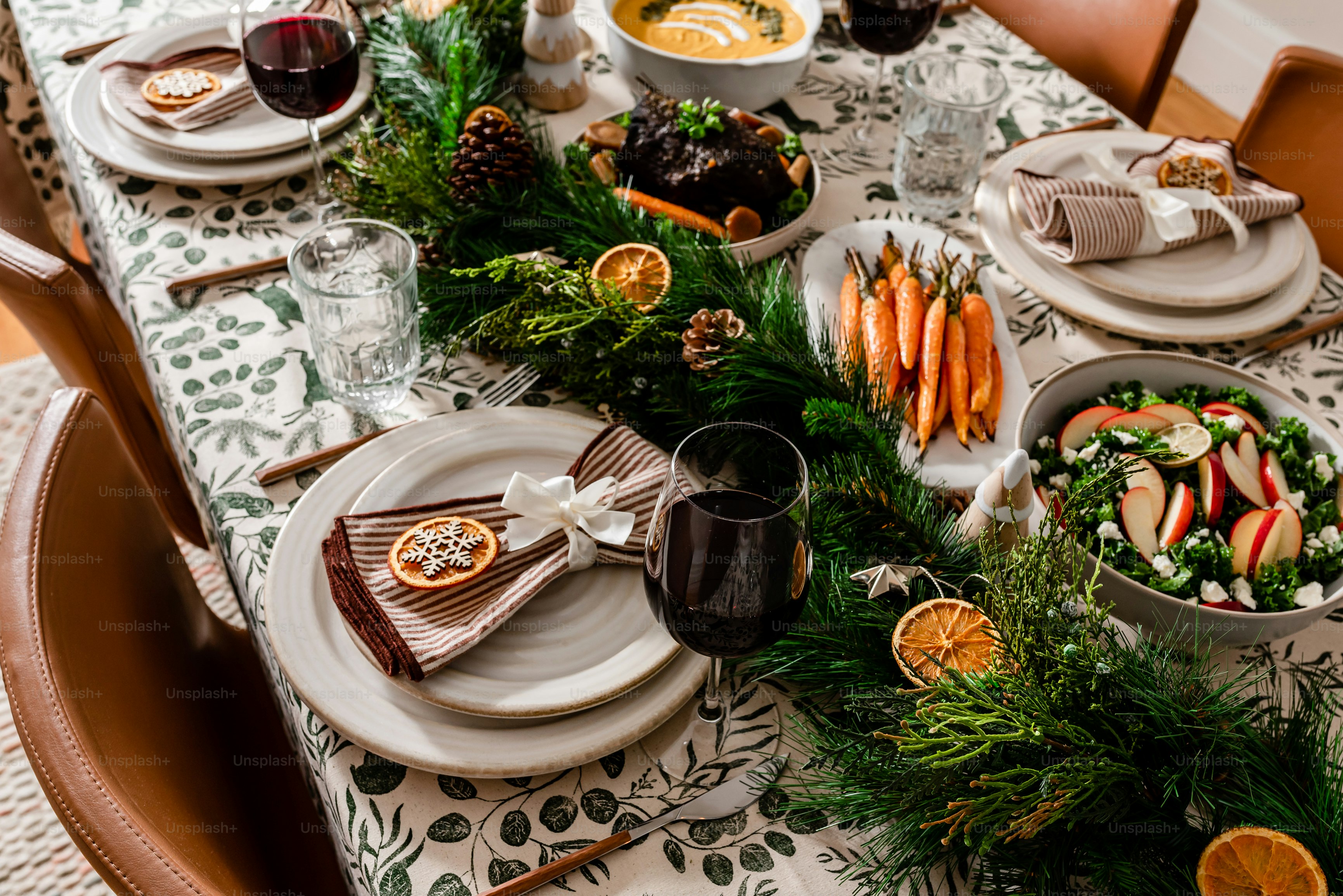 a table is set with plates and bowls of food