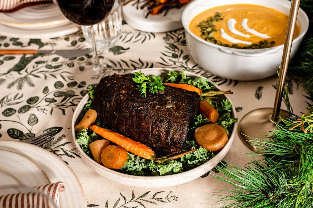 a plate of food on a table with a glass of wine