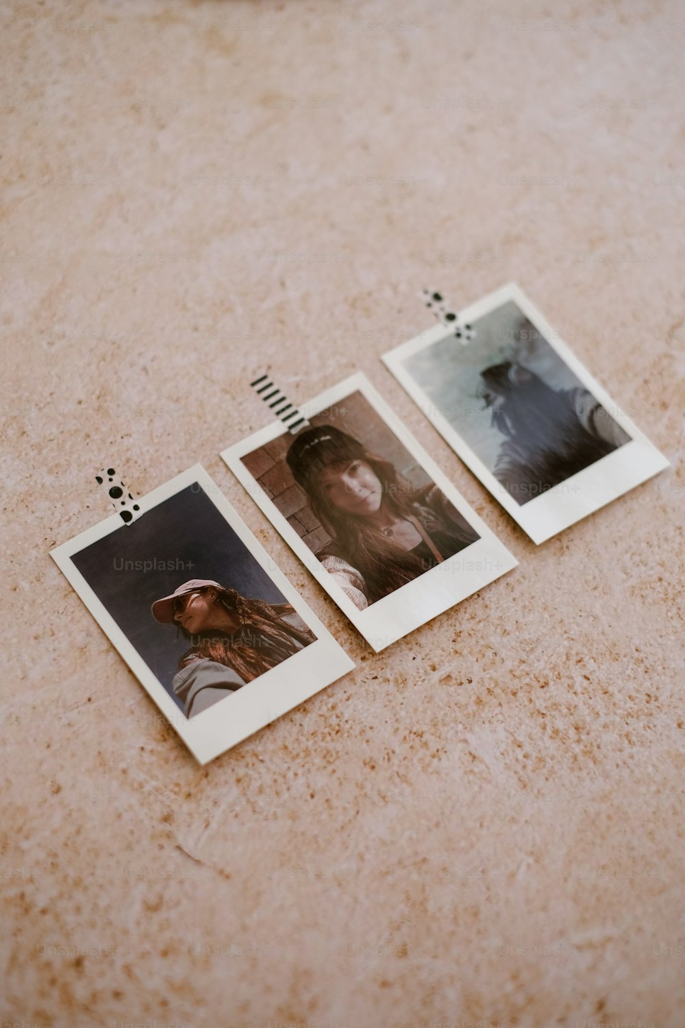 three polaroid photographs of a woman and a man