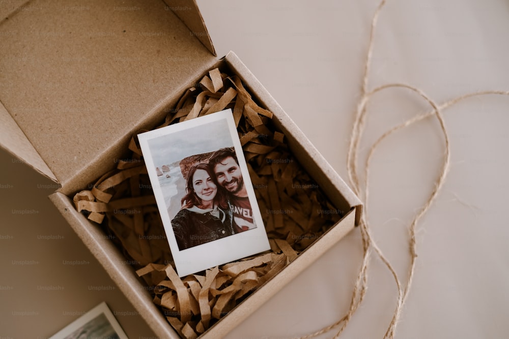 a box with a picture of two people inside of it