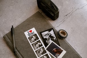 a photo of a couple of people on a table next to a camera