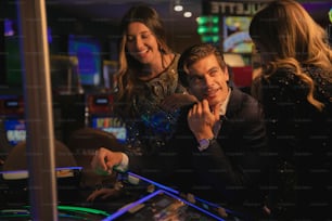 a man and a woman playing a game at a casino