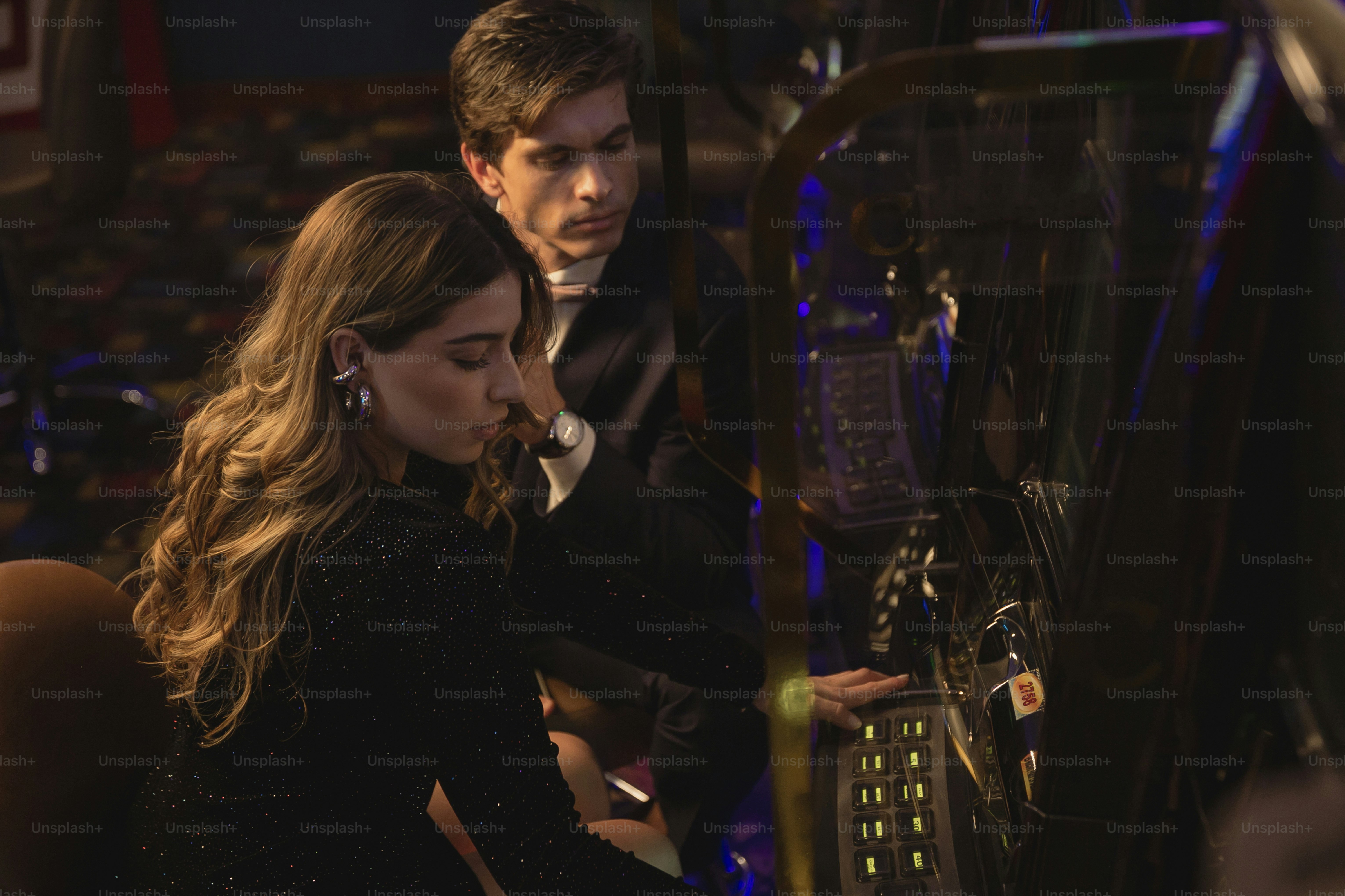 a man and a woman looking at a machine