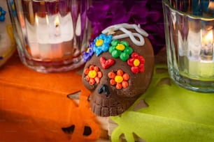 a chocolate skull with colorful decorations on it