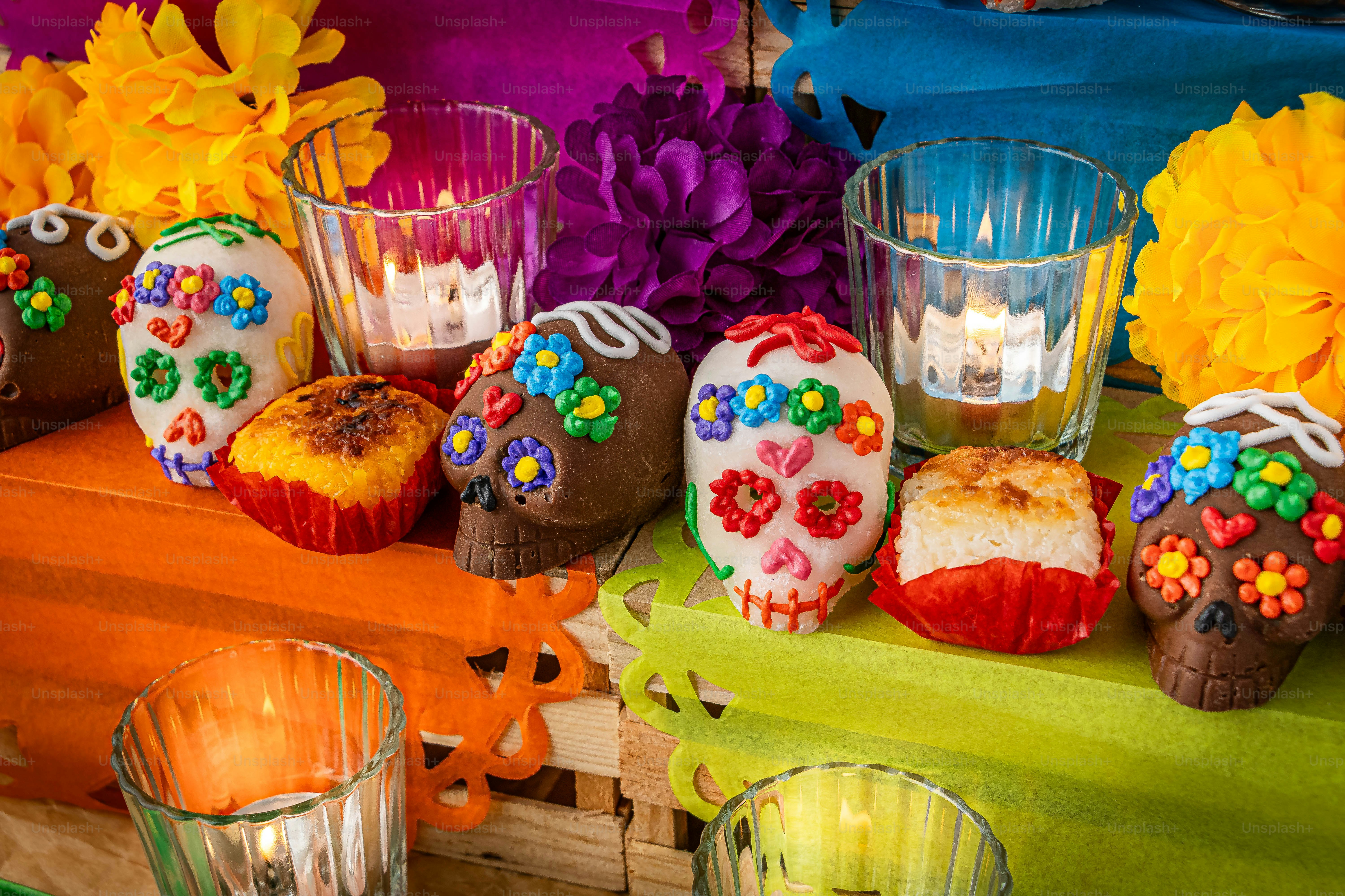 a table topped with cupcakes covered in frosting