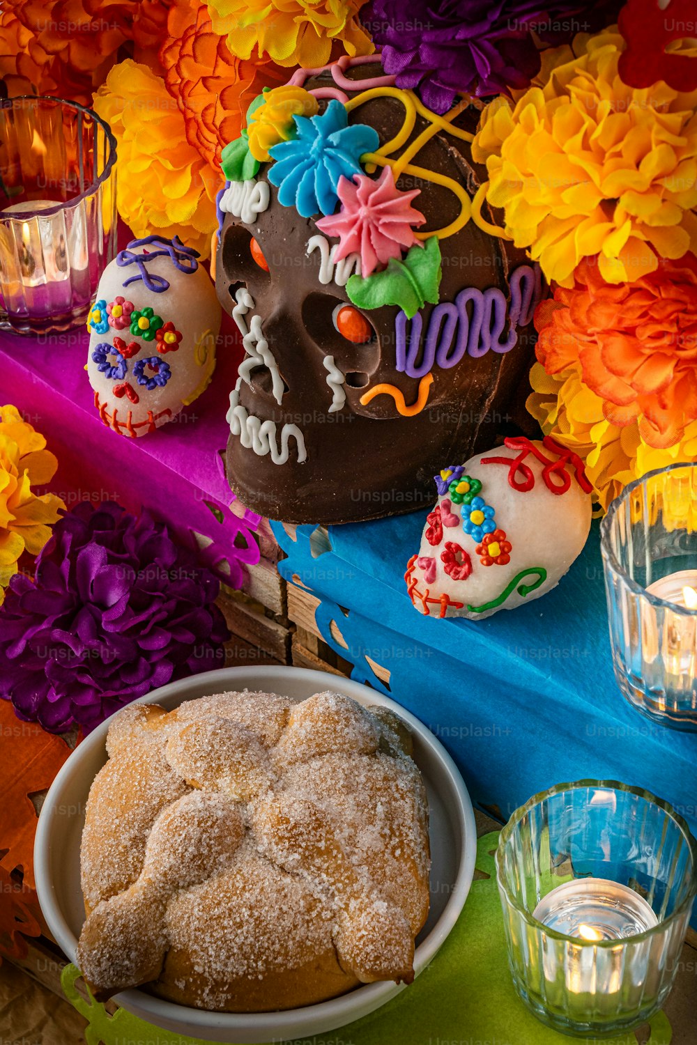 a table topped with a bowl of doughnuts