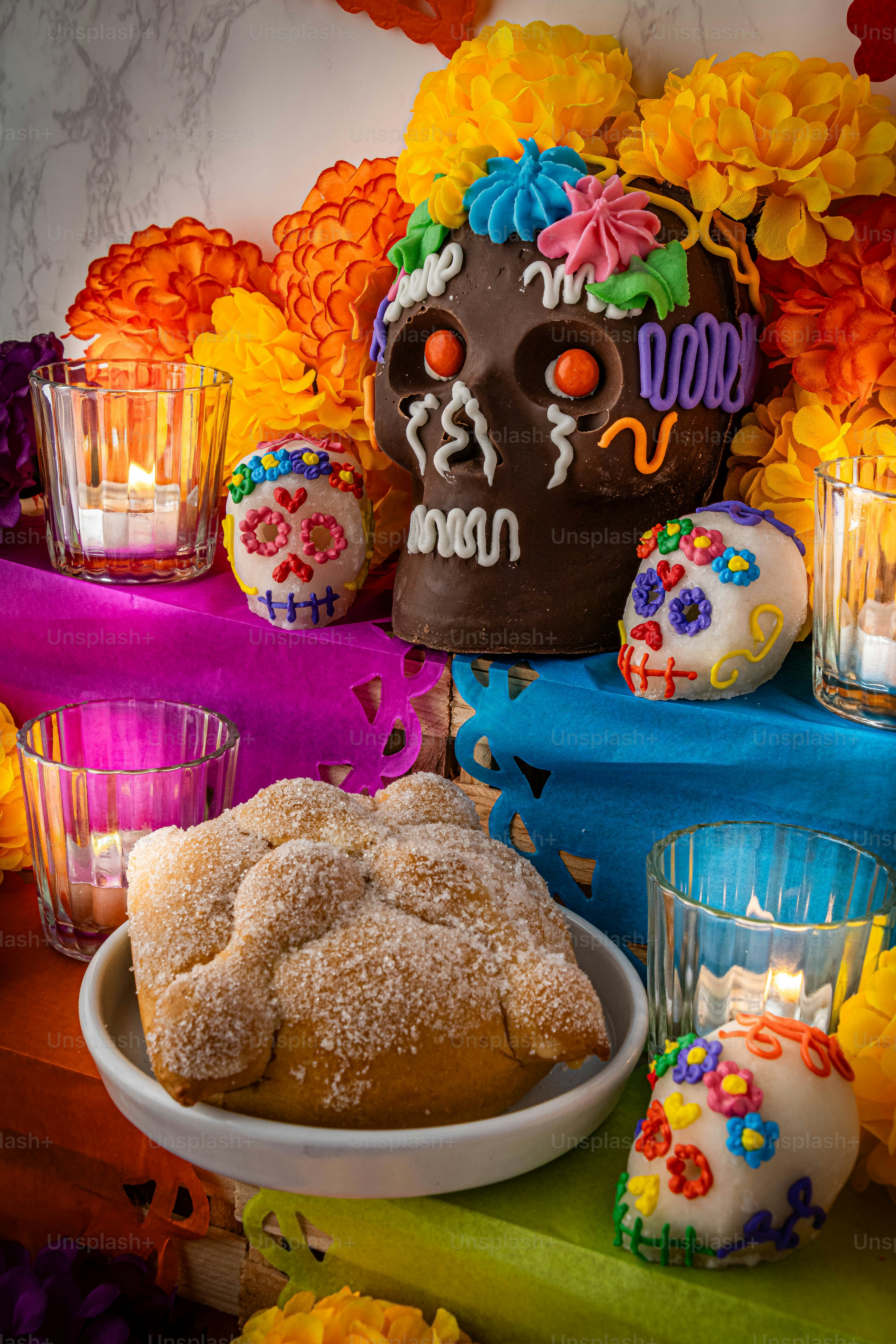a table topped with a cake covered in frosting
