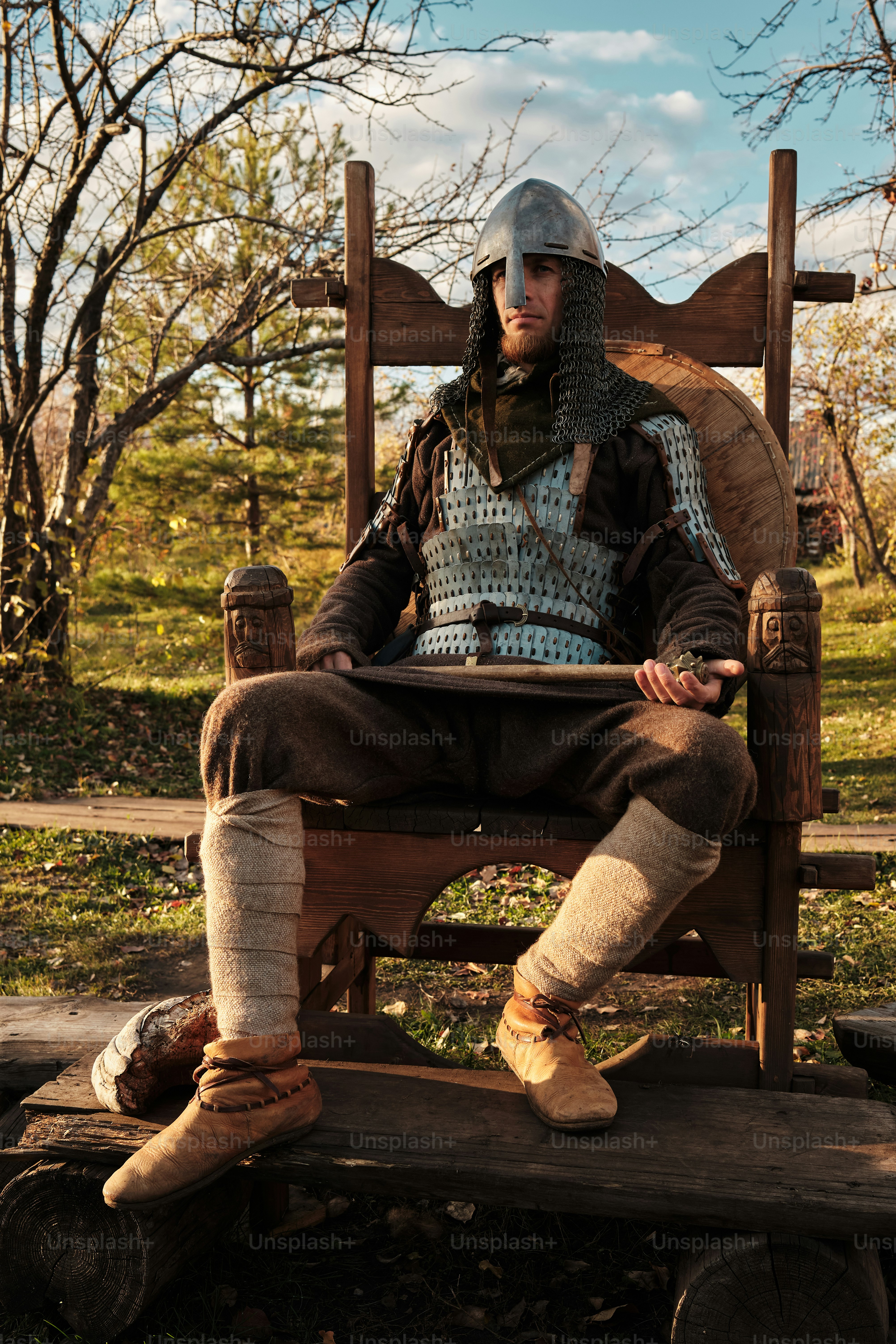 a man sitting in a chair with a broken leg