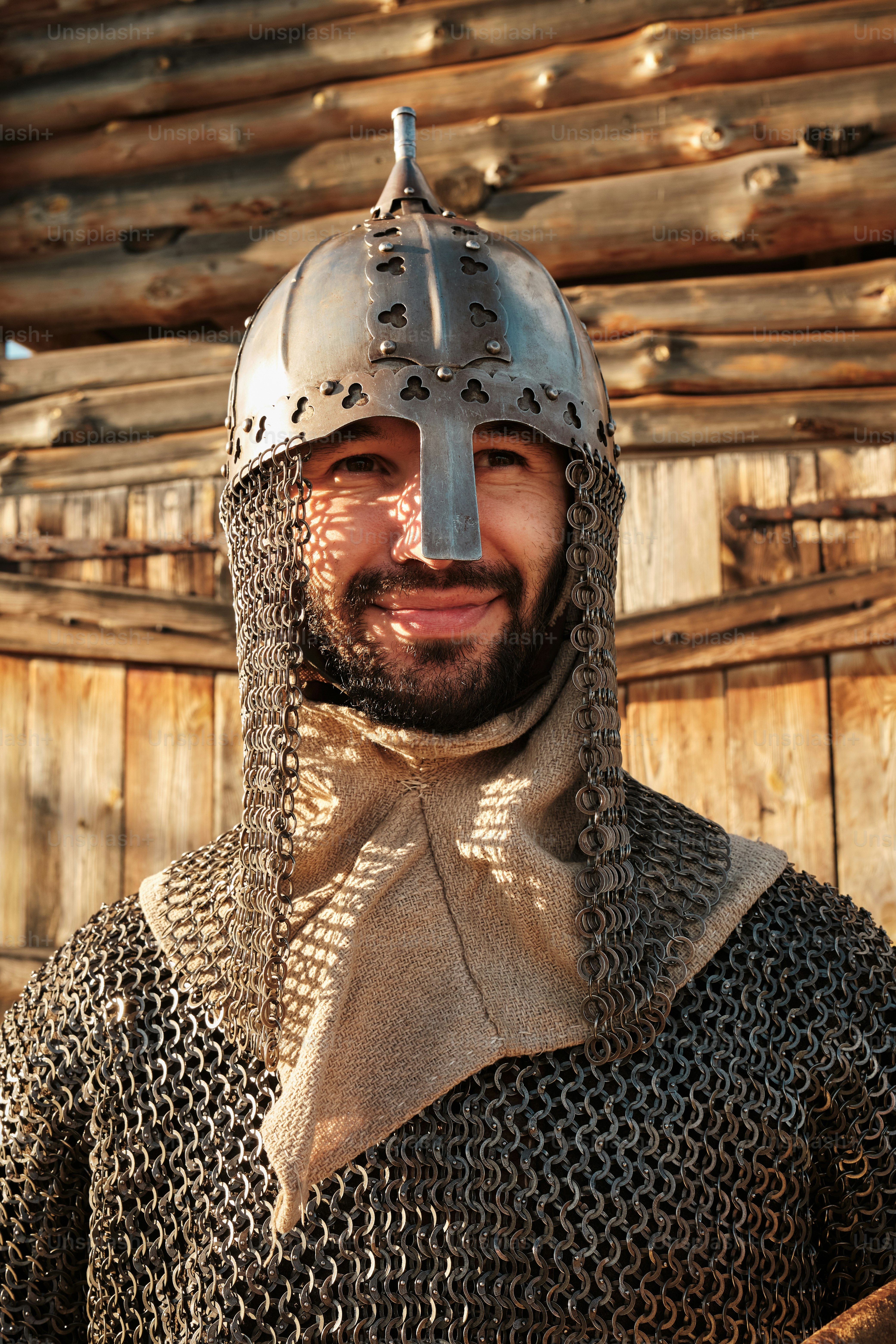 a man wearing a helmet and chain armor