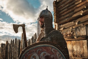 a man dressed in armor and holding a sword