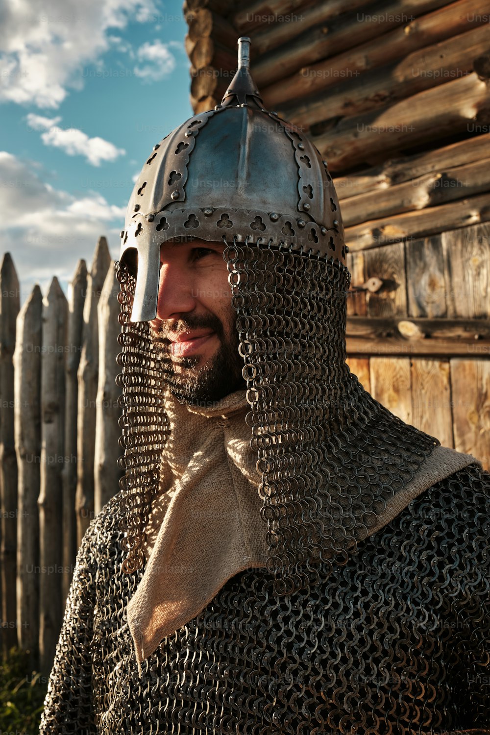 a man wearing a helmet and chain mail