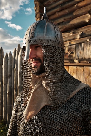 a man wearing a helmet and chain mail