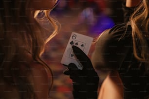 a woman holding a deck of cards in her hands