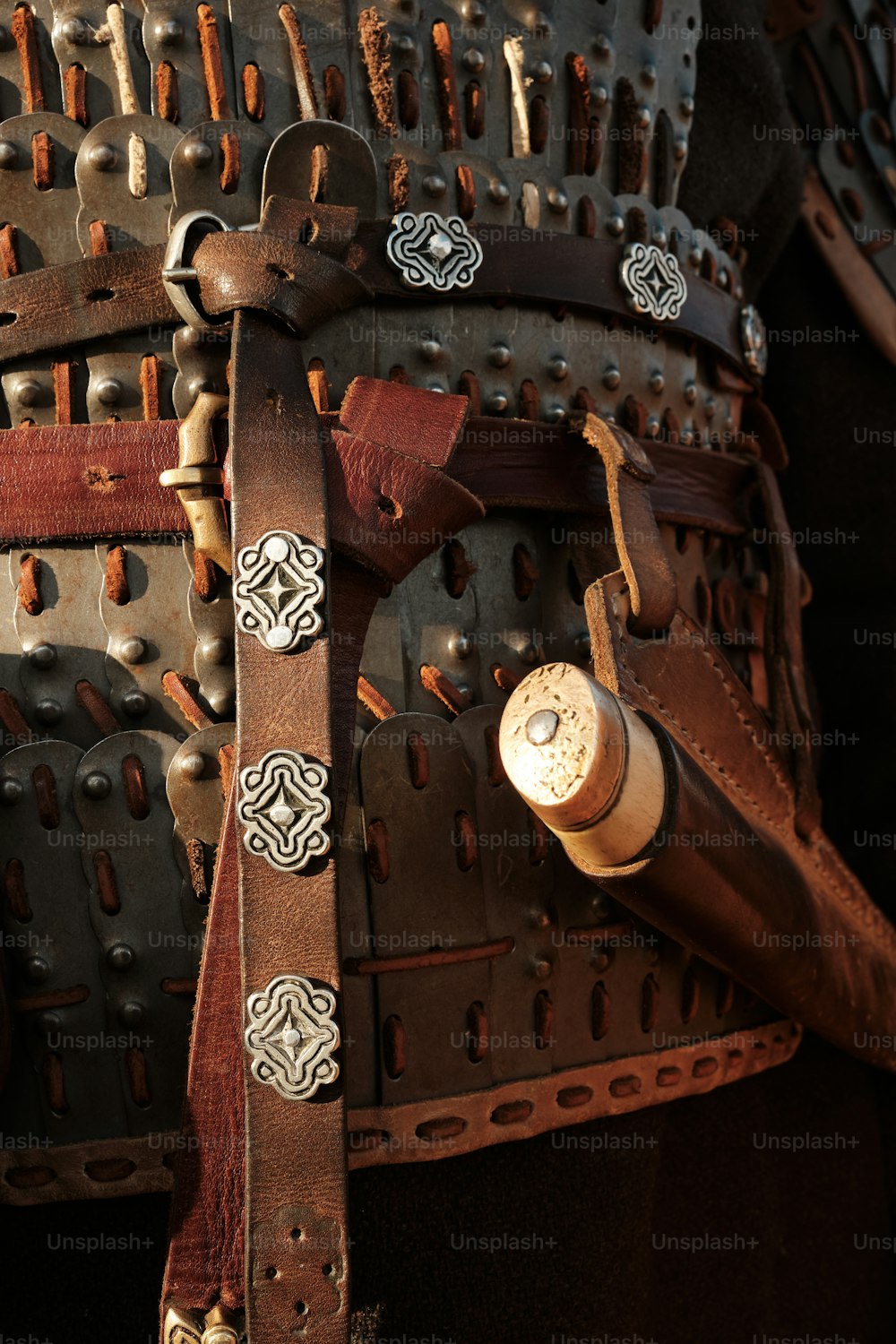 a close up of a leather belt with rivets