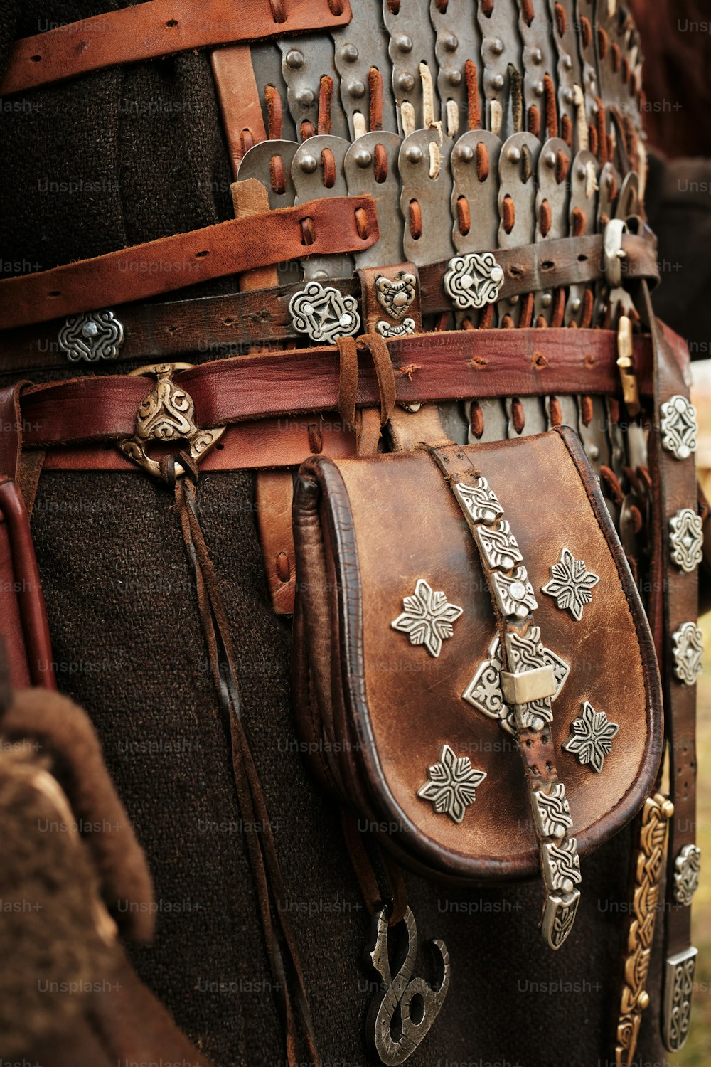 a close up of a person wearing a leather belt