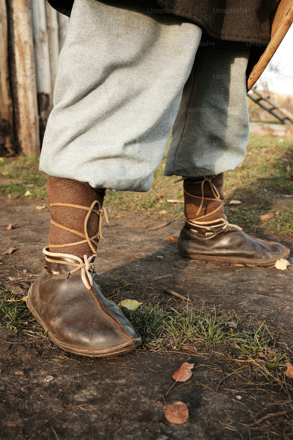 a close up of a person wearing brown boots