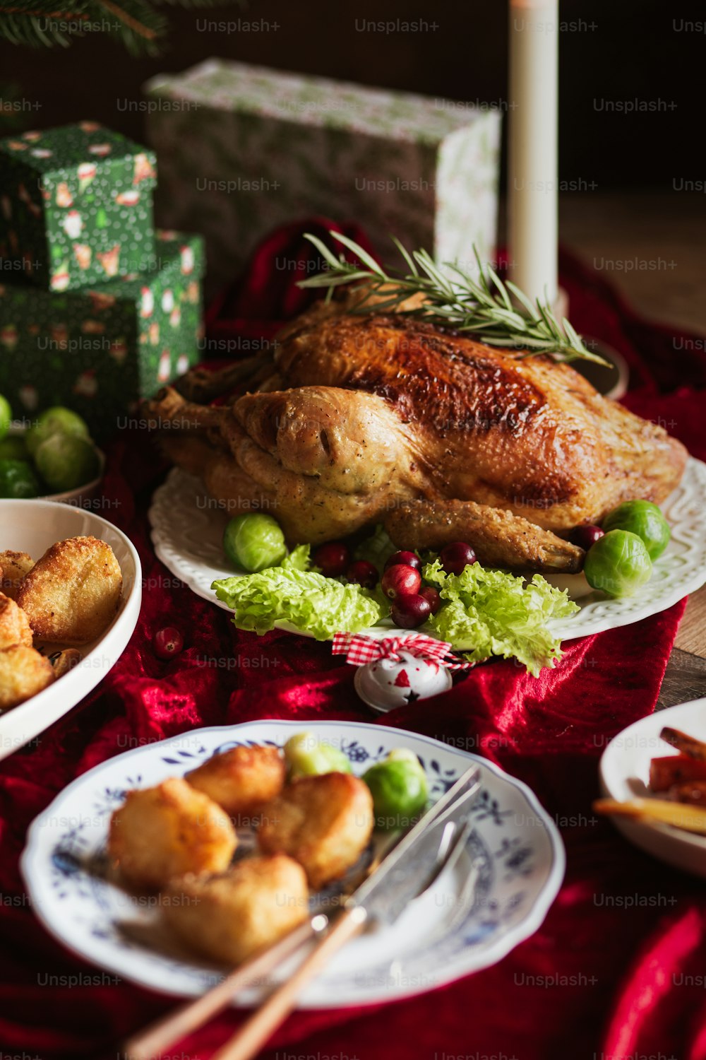 a table topped with plates of food and a turkey