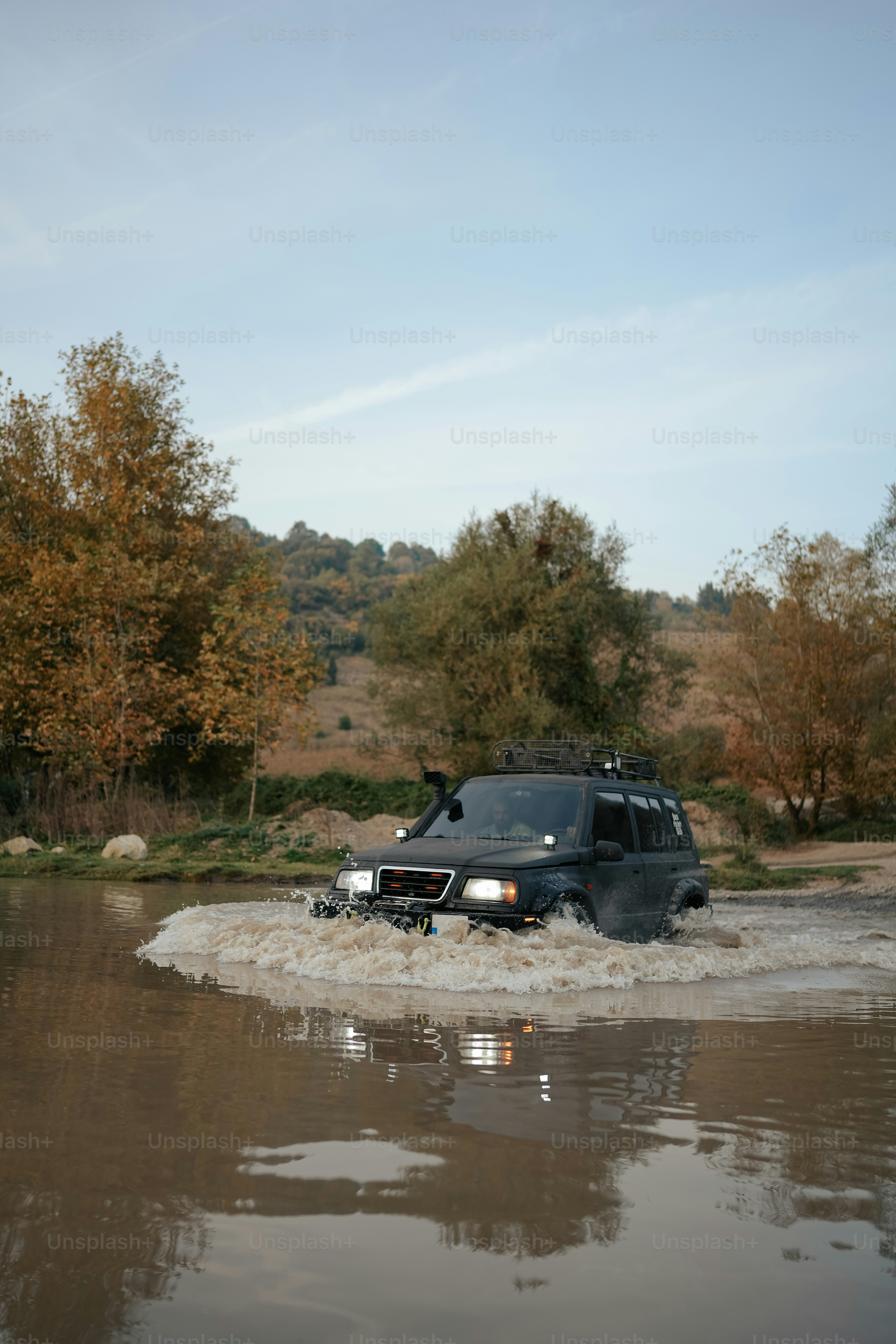 a vehicle is driving through a flooded area
