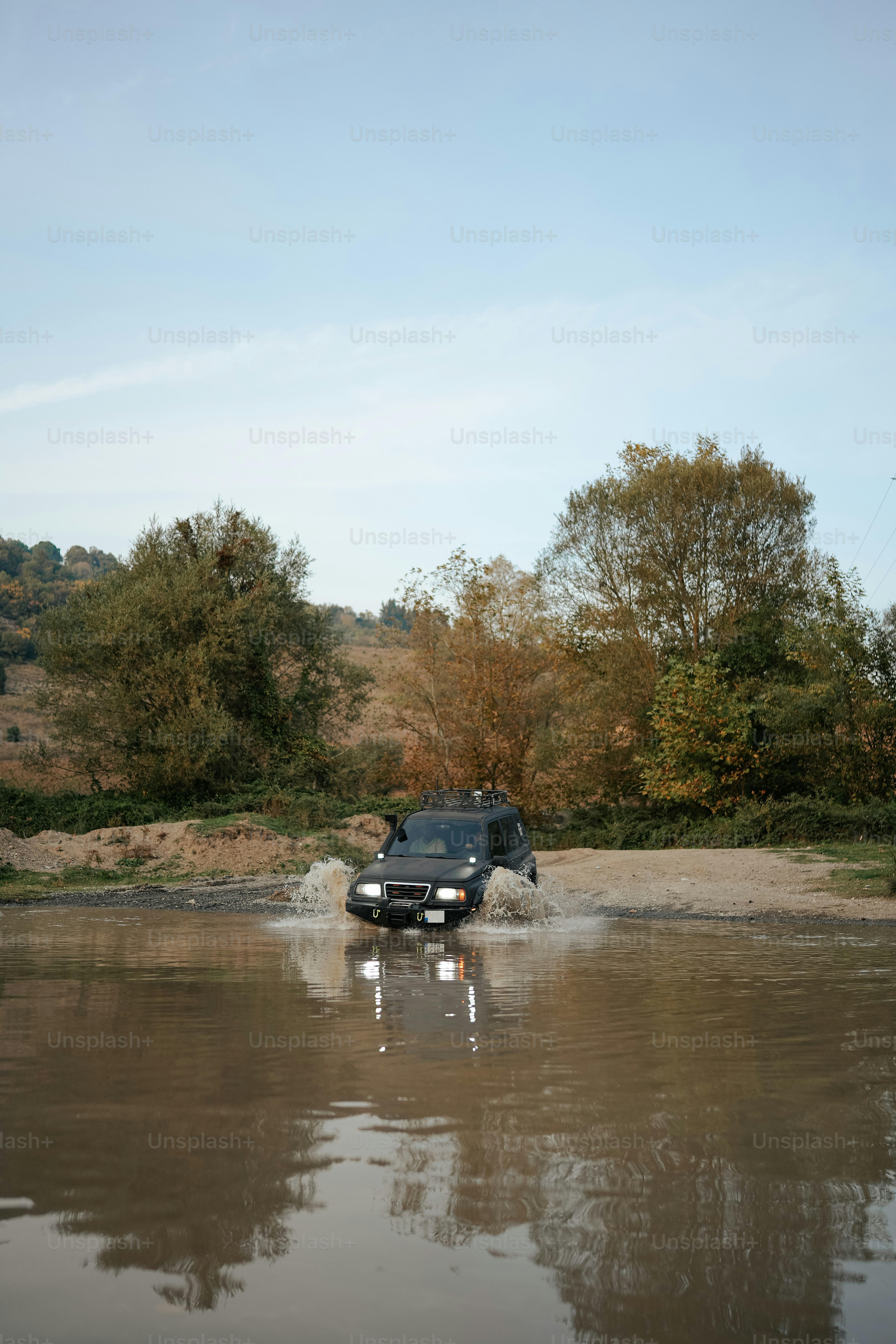 A car driving through a flooded street photo – Adventure Image on Unsplash